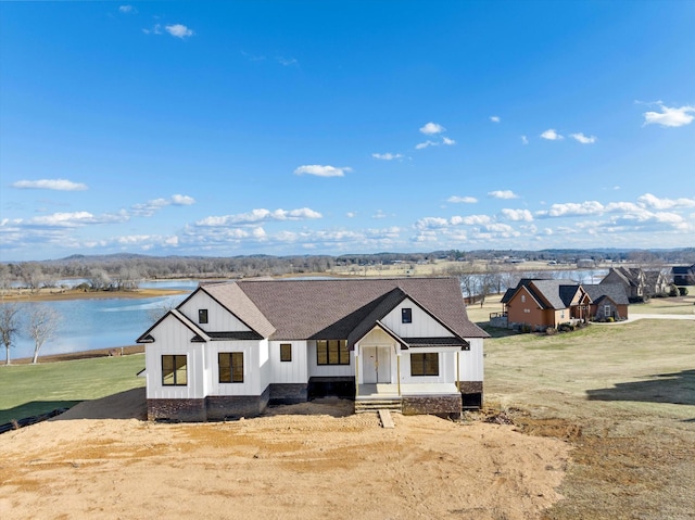 modern inspired farmhouse with a water view