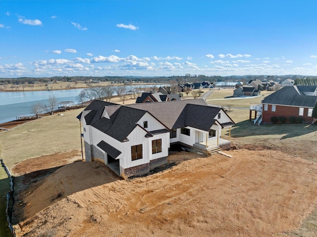 drone / aerial view featuring a water view