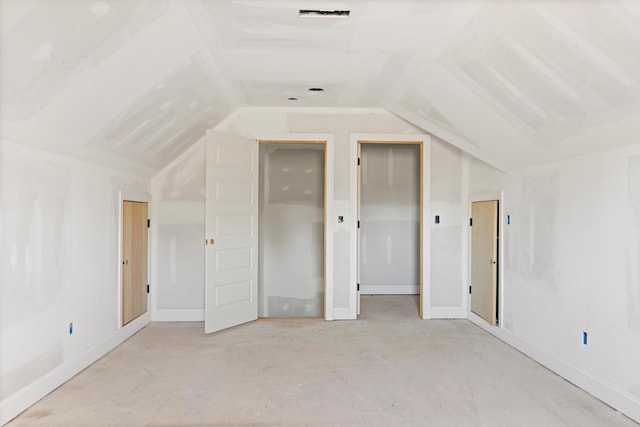 additional living space featuring lofted ceiling