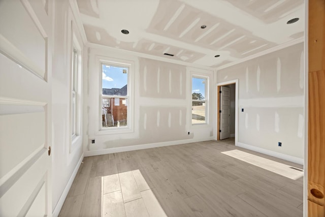 unfurnished room with light hardwood / wood-style flooring