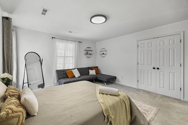 bedroom featuring a closet and carpet flooring