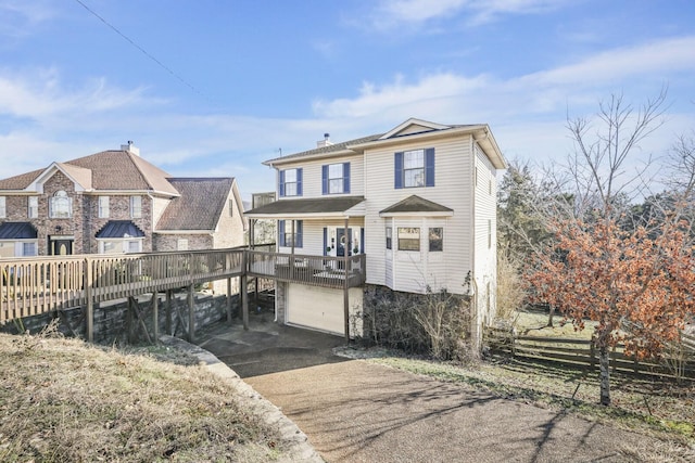 back of property featuring a garage