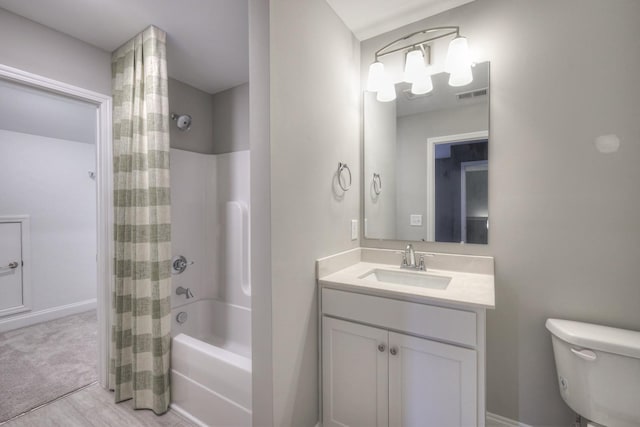 full bathroom with vanity, shower / bath combination with curtain, and toilet