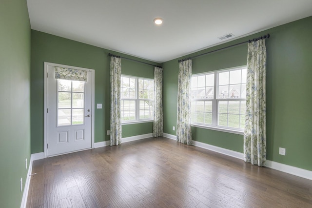 empty room with hardwood / wood-style floors