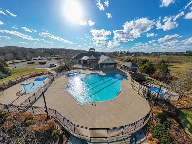 view of swimming pool with a hot tub, a gazebo, and a patio area