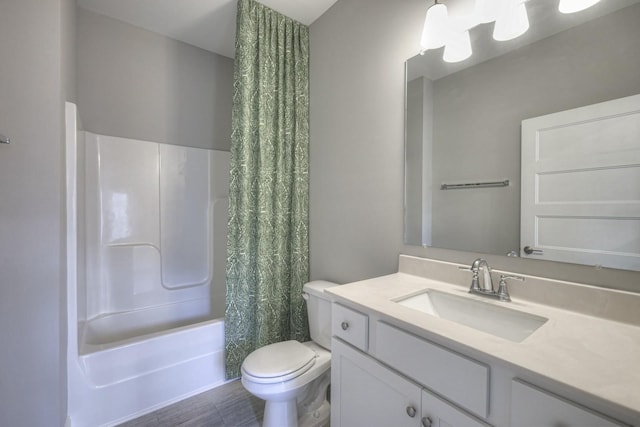 full bathroom with shower / tub combo with curtain, vanity, and toilet