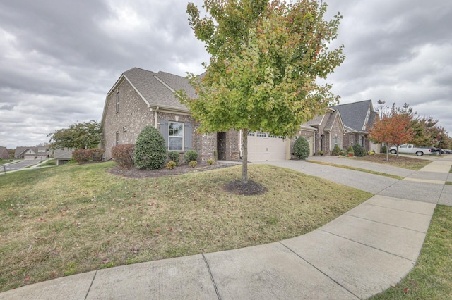 view of front of property featuring a garage and a front yard