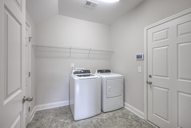 washroom featuring washer and clothes dryer