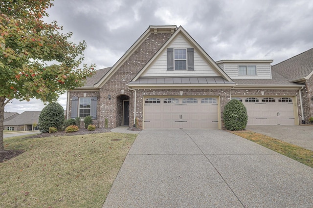 view of front of home featuring a garage and a front yard