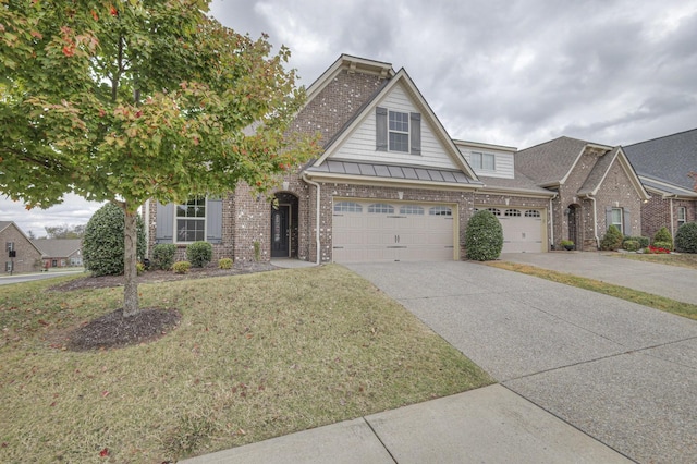 view of front of home featuring a garage and a front lawn