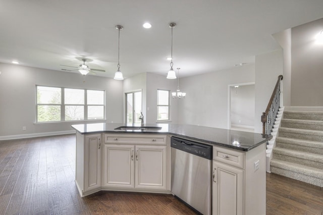 kitchen featuring sink, white cabinetry, dark hardwood / wood-style flooring, dishwasher, and a kitchen island