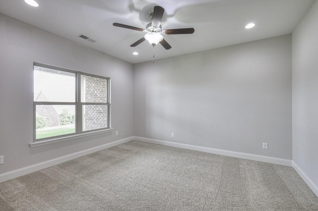 empty room with carpet flooring and ceiling fan