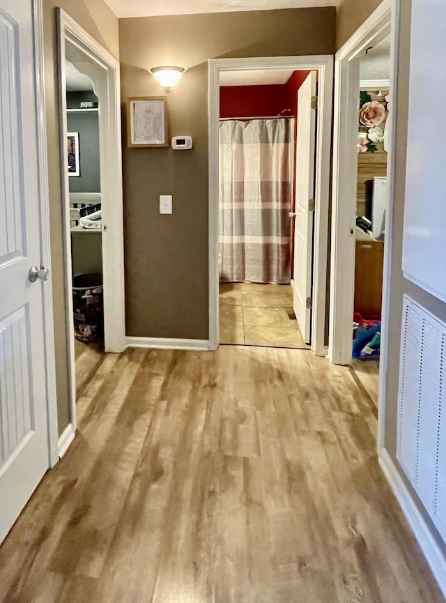 hall featuring light wood-type flooring