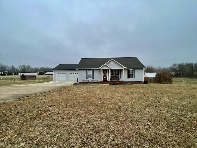 ranch-style house featuring a porch, a garage, and a front lawn