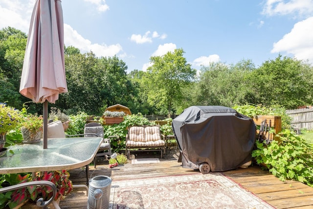 wooden terrace with area for grilling