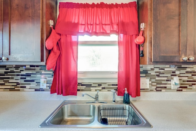 kitchen with sink and decorative backsplash