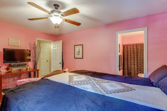 bedroom featuring connected bathroom, a textured ceiling, and ceiling fan