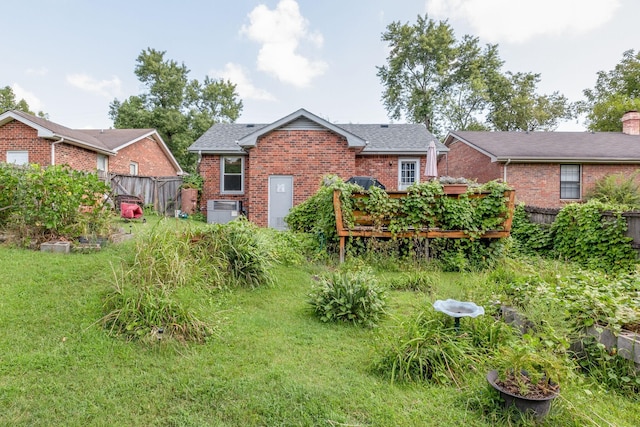 back of property with a wooden deck