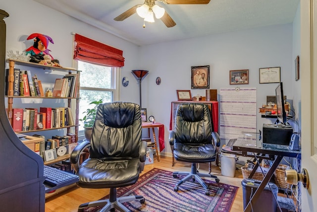 office area with hardwood / wood-style floors and ceiling fan