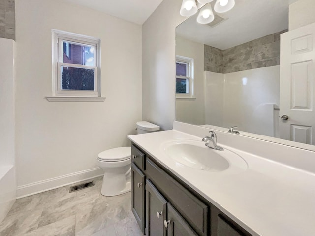 bathroom with vanity and toilet