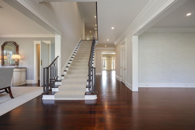 interior space with ornamental molding and dark hardwood / wood-style floors