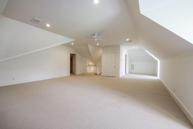 bonus room with lofted ceiling, light carpet, and ceiling fan