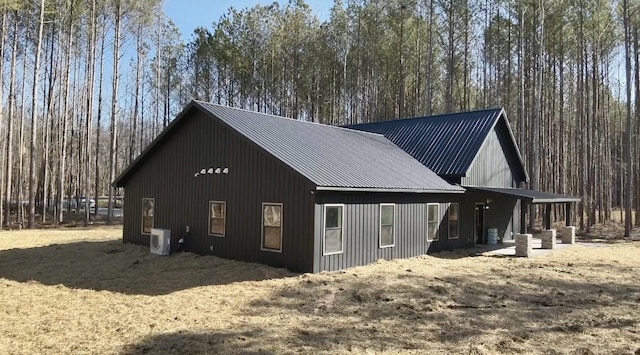 view of side of property with ac unit