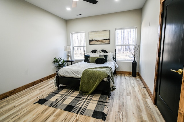 bedroom featuring light hardwood / wood-style flooring and ceiling fan