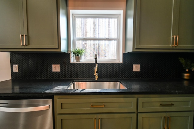 kitchen with dishwasher, sink, green cabinets, and backsplash