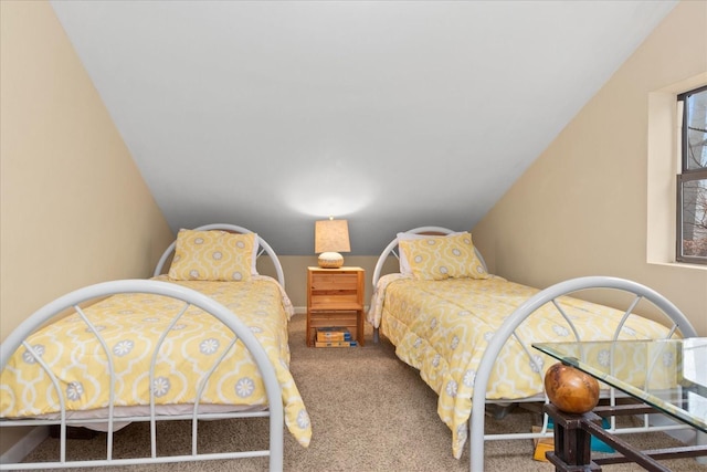 carpeted bedroom with lofted ceiling