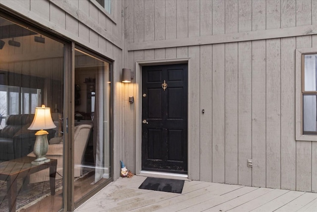 doorway to property with a wooden deck