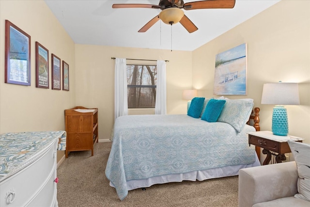 bedroom with ceiling fan and light colored carpet