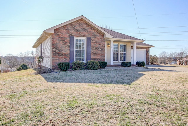 ranch-style home featuring a garage and a front yard