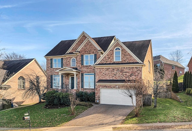 view of front of home featuring a garage and a front yard