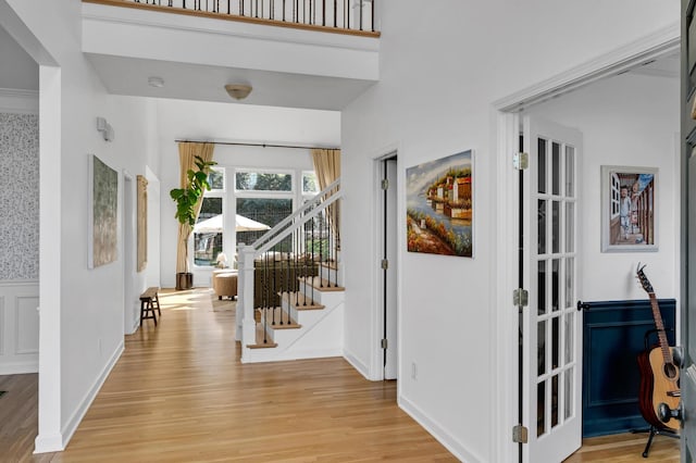 hall with light hardwood / wood-style floors