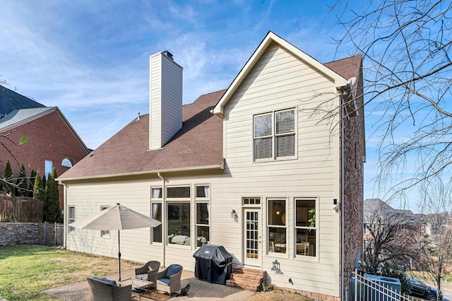 rear view of house with an outdoor living space, a yard, and a patio