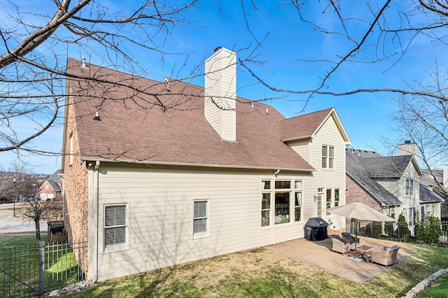 rear view of house featuring a patio