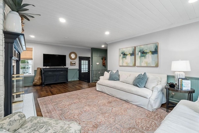 living room with crown molding, wood ceiling, and dark hardwood / wood-style flooring