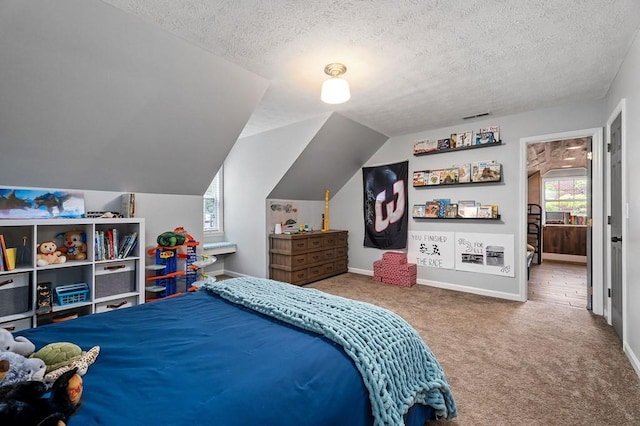 bedroom with multiple windows, vaulted ceiling, and carpet flooring