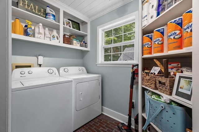 clothes washing area with ornamental molding and independent washer and dryer