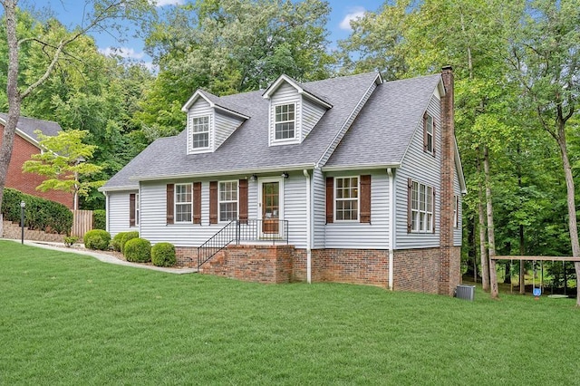 cape cod home with a front yard and central air condition unit