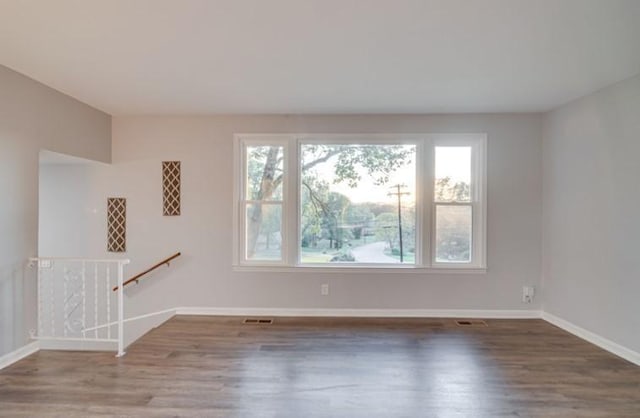 spare room featuring hardwood / wood-style floors