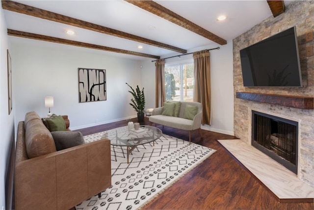 living room with a high end fireplace, wood-type flooring, and beamed ceiling