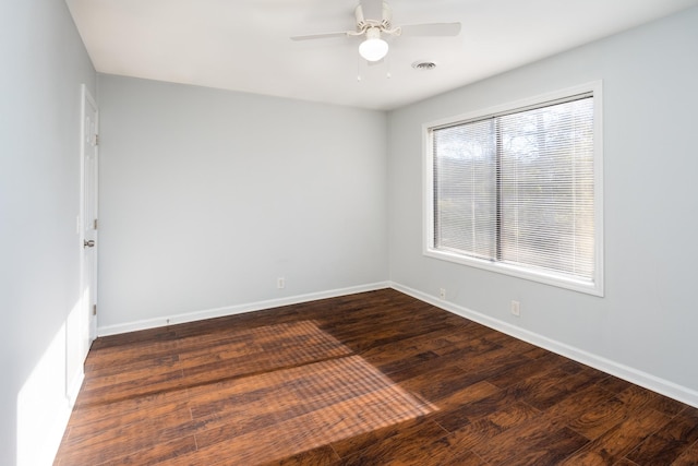 unfurnished room featuring ceiling fan and dark hardwood / wood-style floors