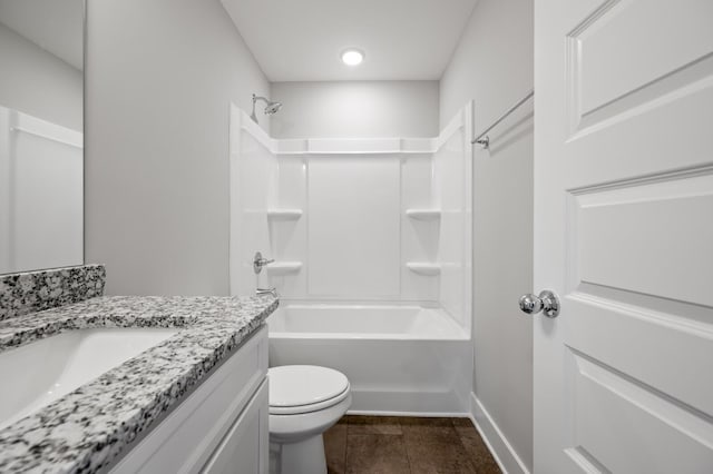 full bathroom with vanity, bathtub / shower combination, and toilet