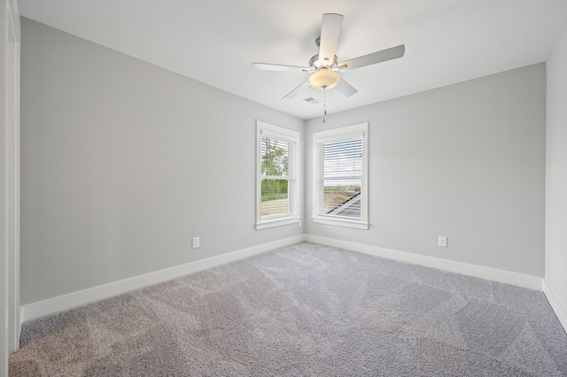 carpeted empty room with ceiling fan