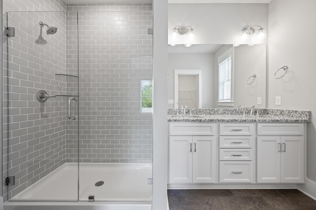 bathroom with vanity and an enclosed shower