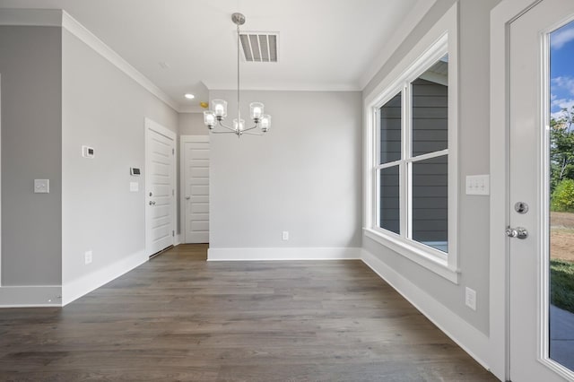 unfurnished dining area with dark hardwood / wood-style flooring, crown molding, and a wealth of natural light