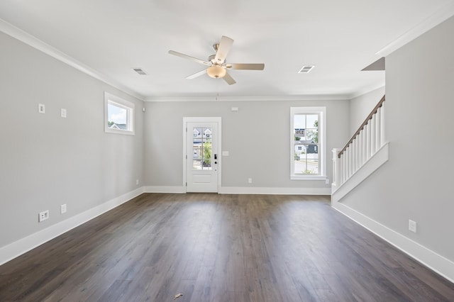 foyer entrance featuring crown molding, dark wood-type flooring, and ceiling fan