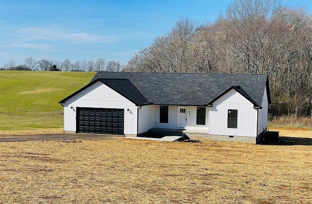 modern farmhouse style home with a garage and a front yard